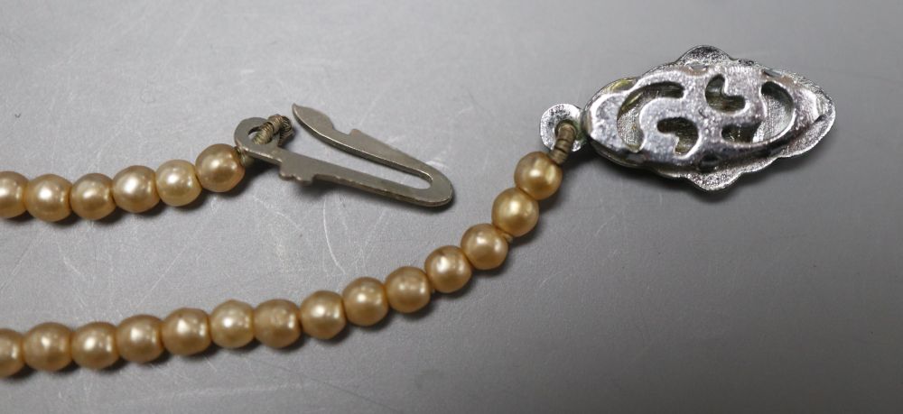 Two single strand cultured pearl necklaces and a simulated pearl necklace.